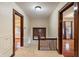 Upstairs hallway with natural light and wood railing at 3901 S Meridian St, Indianapolis, IN 46217