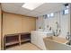Basement laundry room with washer, dryer, utility sink, and shelving at 3901 S Meridian St, Indianapolis, IN 46217