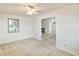 Comfortable bedroom featuring neutral carpet, ample natural light, and an open doorway at 4043 Oak Trail Dr, Indianapolis, IN 46237