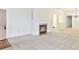 Bright living room with a fireplace, neutral carpet, and open doorways to other rooms at 4043 Oak Trail Dr, Indianapolis, IN 46237