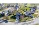 Aerial view of a neighborhood with well-maintained houses, green lawns, mature trees, and well-organized streets at 4801 Copper Grove Dr, Indianapolis, IN 46237