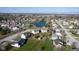 The property has a serene pond and is surrounded by lush greenery and well-maintained homes at 4801 Copper Grove Dr, Indianapolis, IN 46237