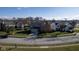 Aerial view of a house with a lush green lawn, mature trees, and neighborhood streets in the suburban area at 4801 Copper Grove Dr, Indianapolis, IN 46237