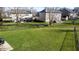 Spacious backyard with a chain-link fence, mature trees, and potential for outdoor activities and gardening at 4801 Copper Grove Dr, Indianapolis, IN 46237