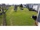 Large, grassy backyard featuring a chain-link fence, a storage shed, and well-maintained landscaping at 4801 Copper Grove Dr, Indianapolis, IN 46237