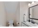 This half bathroom offers a granite countertop, modern fixtures, and a convenient toilet with a clean white towel at 4801 Copper Grove Dr, Indianapolis, IN 46237