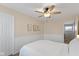 Bedroom featuring a ceiling fan, with beadboard wainscoting and wall art at 4801 Copper Grove Dr, Indianapolis, IN 46237
