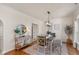 Stylish dining room with hardwood floors, contemporary lighting, and charming decor at 4801 Copper Grove Dr, Indianapolis, IN 46237