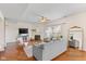 Spacious living room with hardwood floors, a fireplace, and large windows providing natural light at 4801 Copper Grove Dr, Indianapolis, IN 46237