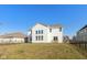 Home's backyard featuring a well-manicured lawn, a fence, and a spacious deck for outdoor enjoyment at 5387 Citadel Dr, Noblesville, IN 46062
