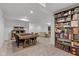 Finished basement offering flexible living space, a game table, and a large bookcase at 5387 Citadel Dr, Noblesville, IN 46062