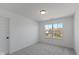 Bright bedroom featuring a large window and neutral carpet at 5387 Citadel Dr, Noblesville, IN 46062