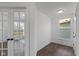 Hallway leading to a bright room featuring double doors and lots of natural light at 5387 Citadel Dr, Noblesville, IN 46062
