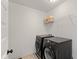 Convenient laundry area equipped with a washer and dryer and practical shelving at 5387 Citadel Dr, Noblesville, IN 46062