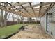 Backyard with wooden pergola covered patio and freshly cut green grass at 5869 Jamestown Square Ln, Indianapolis, IN 46234