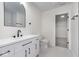 Modern bathroom with sleek vanity, arch mirror, and contemporary fixtures at 5869 Jamestown Square Ln, Indianapolis, IN 46234