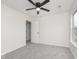 Neutral bedroom features ceiling fan, a closet and a bright window at 5869 Jamestown Square Ln, Indianapolis, IN 46234