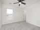 Neutral bedroom featuring a ceiling fan, carpeted floors, and a bright window at 5869 Jamestown Square Ln, Indianapolis, IN 46234