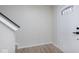 Clean entryway with light walls, hard surface floors, and modern white door with glass insert at 5869 Jamestown Square Ln, Indianapolis, IN 46234