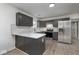 Renovated kitchen featuring stainless steel appliances, gray cabinets, and light countertops at 5869 Jamestown Square Ln, Indianapolis, IN 46234