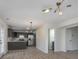 Bright living space with modern lighting, white walls, hard surface flooring, open to kitchen at 5869 Jamestown Square Ln, Indianapolis, IN 46234