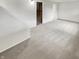 A cozy carpeted basement with white painted walls and access to storage space, great for entertainment and relaxation at 5927 Timber Lake Blvd, Indianapolis, IN 46237