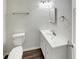 Clean half-bathroom with modern vanity, sink, mirror, and lighting fixtures, offering a comfortable and convenient space at 5927 Timber Lake Blvd, Indianapolis, IN 46237