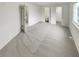 Bright and airy bedroom featuring a large window, neutral carpet, and a closet at 5927 Timber Lake Blvd, Indianapolis, IN 46237