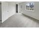 Bright bedroom with natural light, closet, and access to a private door, offering relaxation and convenience at 5927 Timber Lake Blvd, Indianapolis, IN 46237