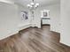 Bright dining area featuring wood floors, built-in bench seating, and an open view into the adjacent kitchen space at 5927 Timber Lake Blvd, Indianapolis, IN 46237