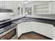 Well-lit kitchen featuring white cabinetry, modern appliances, and an undermount stainless steel sink at 5927 Timber Lake Blvd, Indianapolis, IN 46237