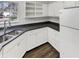 Modern kitchen with stainless steel sink, granite countertops, white cabinets, and plenty of natural light from the window at 5927 Timber Lake Blvd, Indianapolis, IN 46237