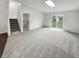An open-concept living space featuring ample natural light, fresh paint, and stairs to the upper level at 5927 Timber Lake Blvd, Indianapolis, IN 46237