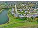 Suburban neighborhood aerial view showing a pond, green spaces, and well-kept homes at 6110 Tanana Dr, Carmel, IN 46033