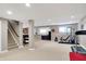Finished basement with stairs, exercise equipment, and a snack bar at 6110 Tanana Dr, Carmel, IN 46033