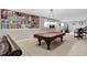 Basement with a pool table, exercise equipment, and a vinyl record wall at 6110 Tanana Dr, Carmel, IN 46033