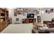 Finished basement with a large entertainment center, seating area, and a bookshelf at 6110 Tanana Dr, Carmel, IN 46033