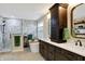 Bright bathroom featuring double sinks, a soaking tub, and a glass-enclosed shower at 6110 Tanana Dr, Carmel, IN 46033