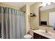 Neutral bathroom with a shower/tub combination, a single sink vanity, and decorative accents at 6110 Tanana Dr, Carmel, IN 46033