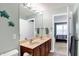 Bathroom with double vanity and a view into the bedroom at 6110 Tanana Dr, Carmel, IN 46033