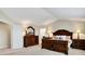 Spacious bedroom with a large window, neutral carpet and sophisticated wood furniture at 6110 Tanana Dr, Carmel, IN 46033