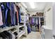 Walk-in closet with custom shelving and storage for clothes, shoes, and accessories at 6110 Tanana Dr, Carmel, IN 46033