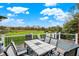 Outdoor dining area with seating, a grill, and a scenic view of the landscape at 6110 Tanana Dr, Carmel, IN 46033