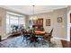 Classic dining room with bay window, wooden furniture, and chandelier at 6110 Tanana Dr, Carmel, IN 46033