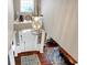 Bright foyer features a decorative chandelier, front door with sidelights and beautiful hardwood floors at 6110 Tanana Dr, Carmel, IN 46033