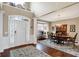 Inviting foyer with high ceilings, hardwood floors, and a view of the dining room at 6110 Tanana Dr, Carmel, IN 46033