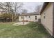 Backyard featuring a patio with a brick firepit at 631 E 86Th St, Indianapolis, IN 46240