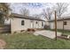 Backyard featuring a patio, fire pit, and shed, offering an inviting outdoor living space at 631 E 86Th St, Indianapolis, IN 46240