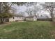 A spacious backyard featuring a detached garage and patio area at 631 E 86Th St, Indianapolis, IN 46240