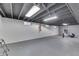 An unfinished basement showing a painted floor, bright lighting and painted walls, offering versatile potential at 631 E 86Th St, Indianapolis, IN 46240